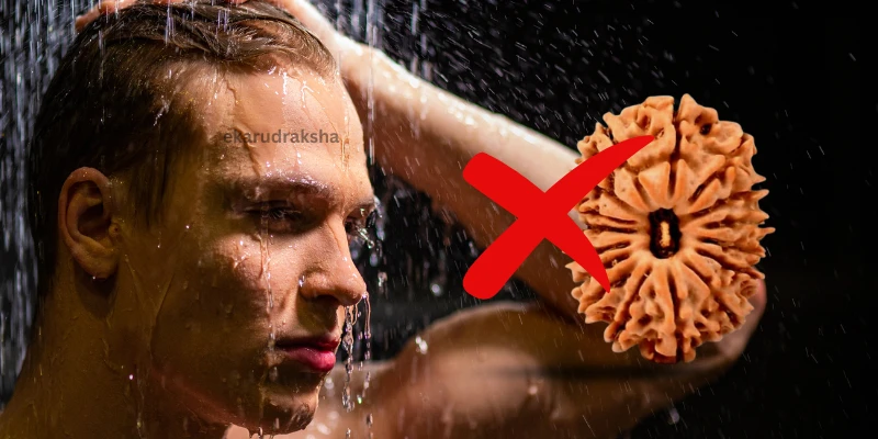 a person is wearing rudraksha while taking shower